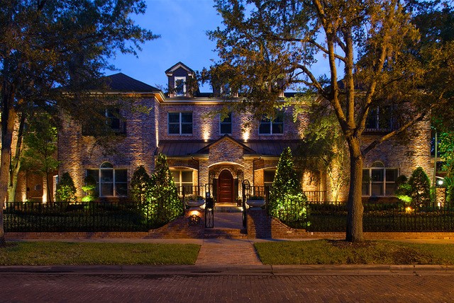 lighting for landscaping in front of luxury home
