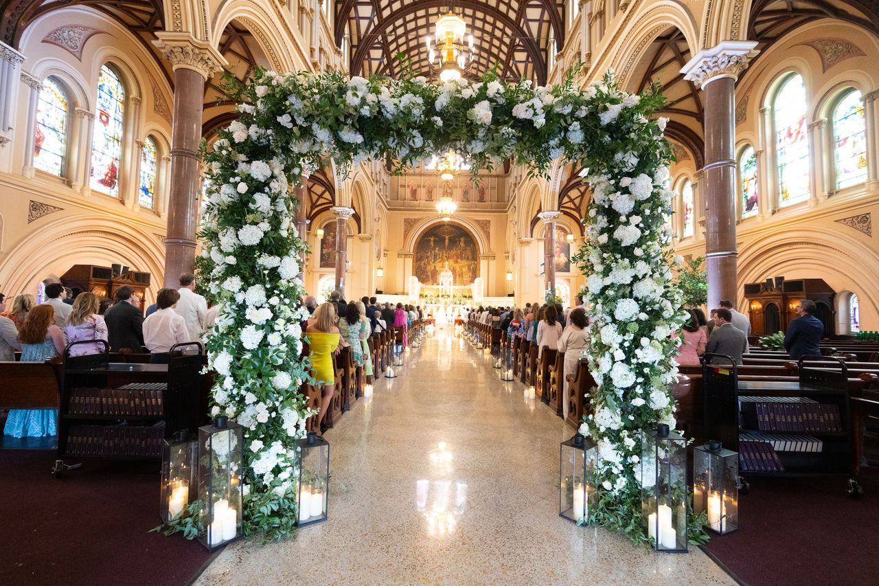 White and Green Wedding Ceremony Arch in Church