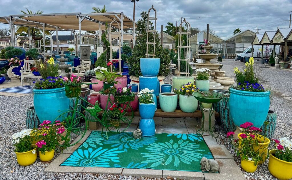 A colorful and lively display of lush plants and decorative pots at the TPG Garden Center